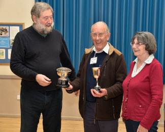 Brian takes 2 trophies from Dave and Jan